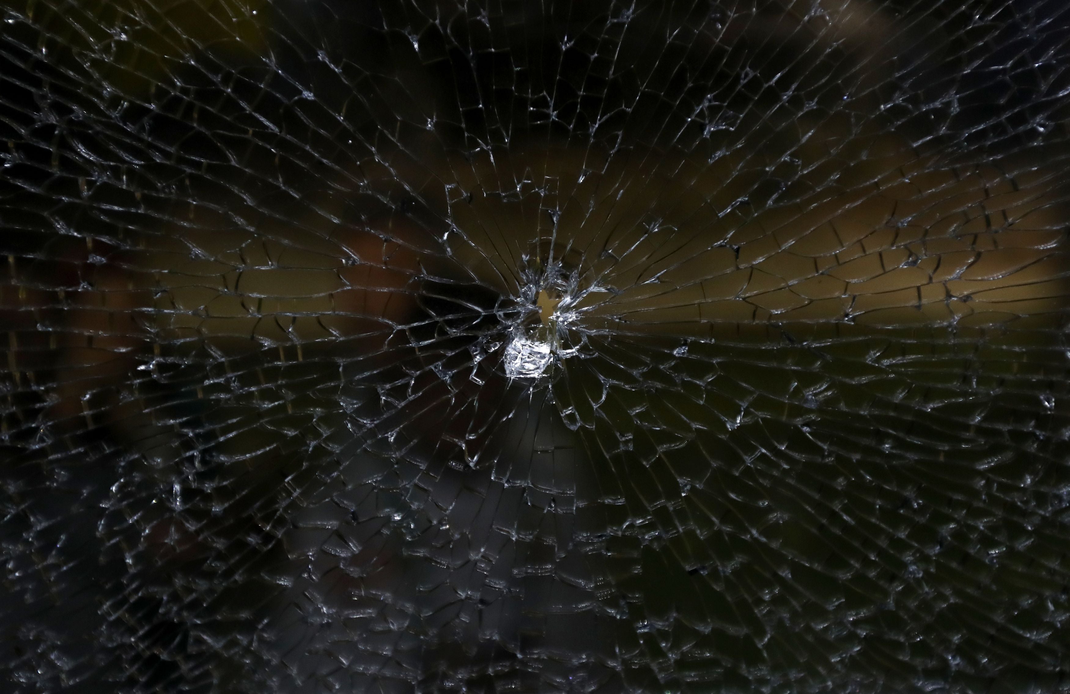 Damage to one of the bus windows, thought to have been caused by a gunshot. Picture: David Davies/PA Wire